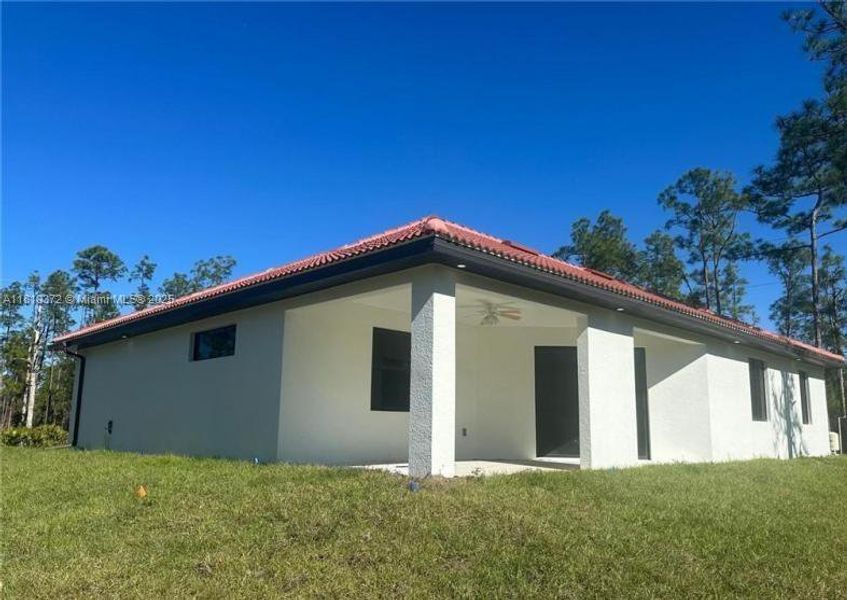 Front exterior of a new home in , Lehigh Acres, FL, highlighting curb appeal (Image 1). Front exterior of a new home in , Lehigh Acres, FL, highlighting curb appeal (Image 1).