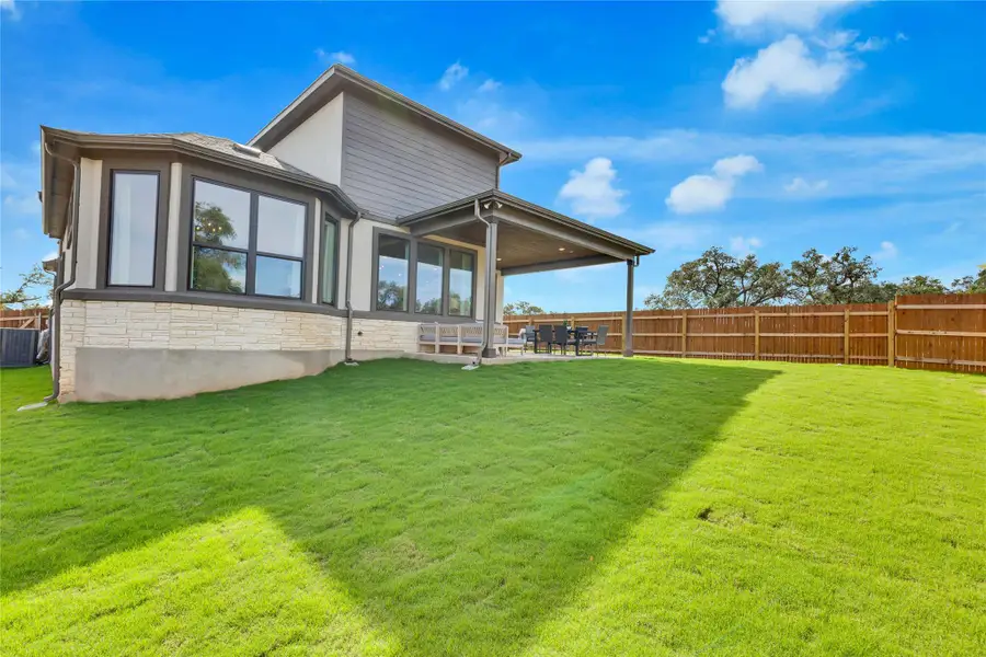 Exterior details and patio area of a home in Retreat at San Gabriel, Georgetown (Image 3).