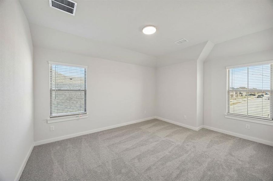 Bedroom in the Wimbledon home plan by Trophy Signature Homes – REPRESENTATIVE PHOTO