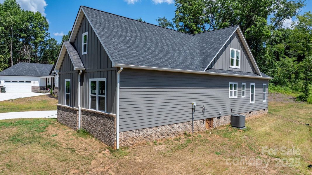 Front exterior of a new home in , Hickory, NC, highlighting curb appeal (Image 25).