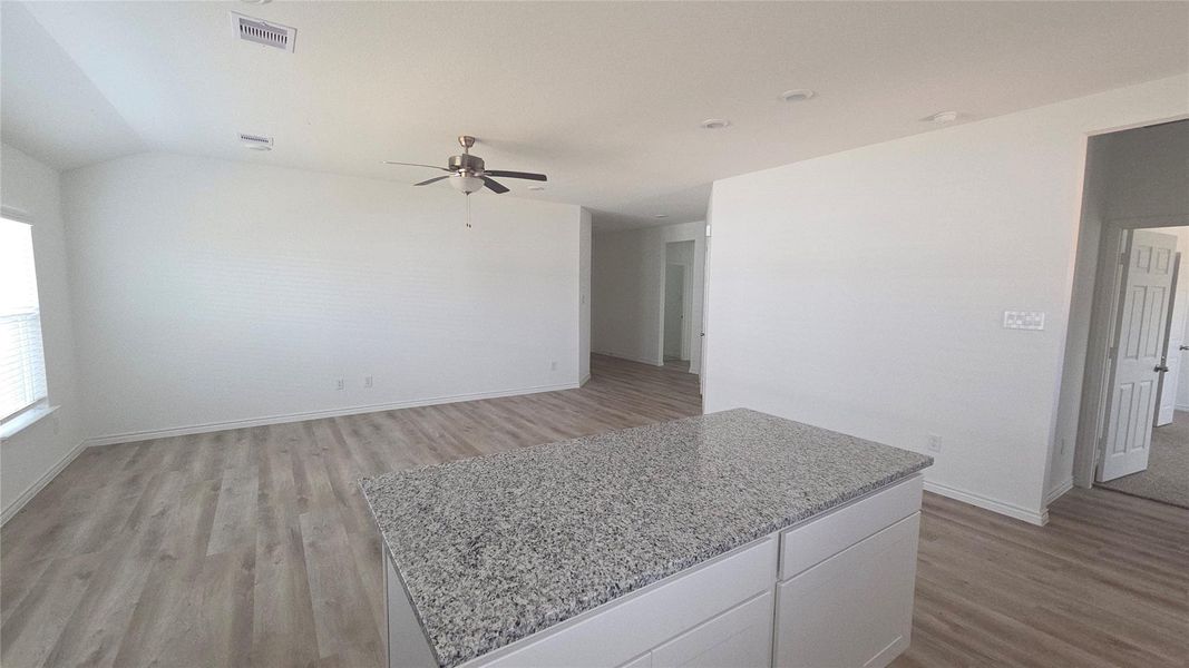 View from kitchen to doorway. Nice island for gatherings and serving.