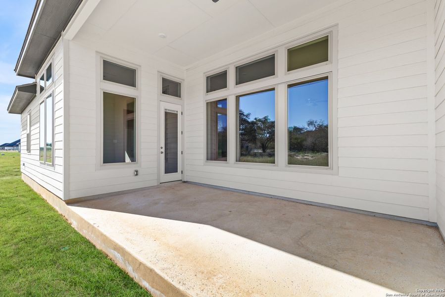 Exterior details and patio area of a home in Pradera Ridge, Floresville (Image 3). Exterior details and patio area of a home in Pradera Ridge, Floresville (Image 3).