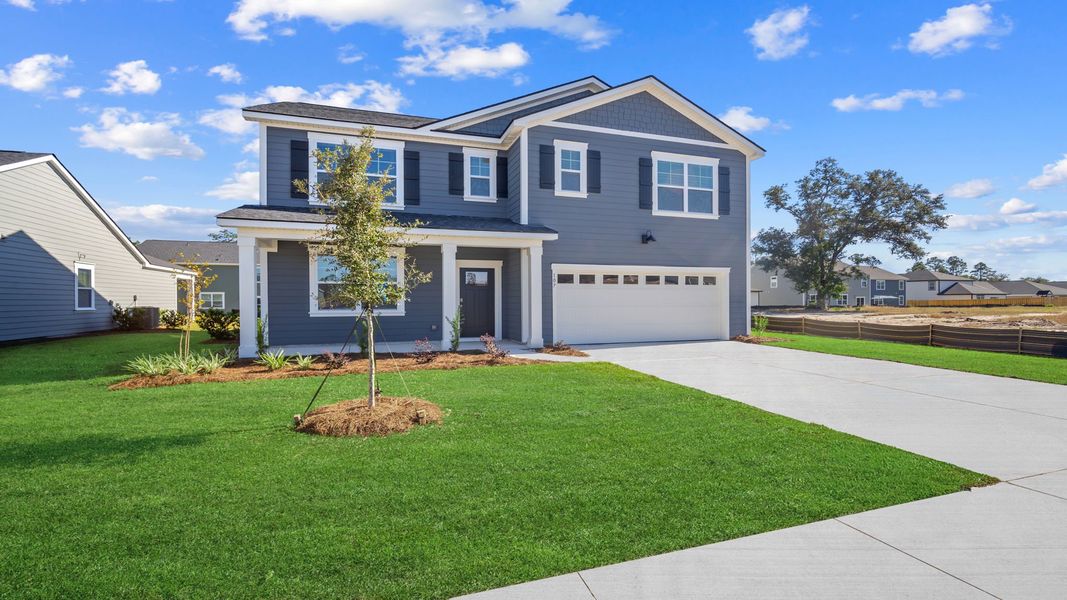 Front exterior of a new home in Laurel Grove, Guyton, GA, highlighting curb appeal (Image 2). Front exterior of a new home in Laurel Grove, Guyton, GA, highlighting curb appeal (Image 2).