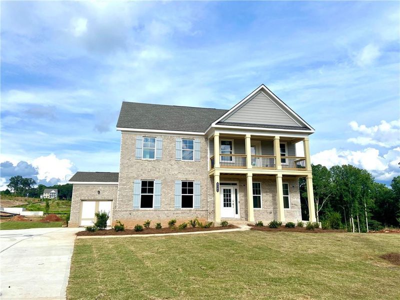 Front exterior of a new home in Estates at Yellow Creek, Cumming, GA, highlighting curb appeal (Image 1). Front exterior of a new home in Estates at Yellow Creek, Cumming, GA, highlighting curb appeal (Image 1).