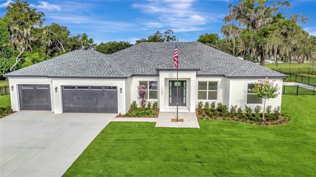Front exterior of a new home in , Montverde, FL, highlighting curb appeal (Image 20). Front exterior of a new home in , Montverde, FL, highlighting curb appeal (Image 20).