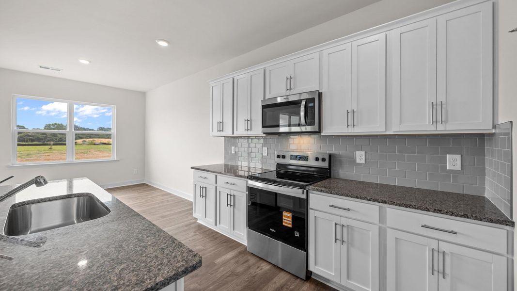 Furnished interior view inside a new home in Beaver Dam Crossing, Bailey (Image 7).