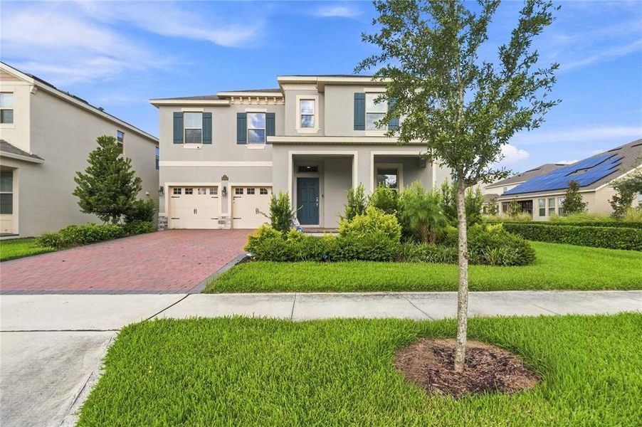 Front exterior of a new home in , Winter Garden, FL, highlighting curb appeal (Image 26).
