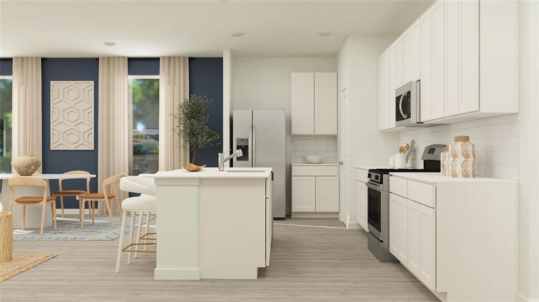 Kitchen featuring a center island with sink, stainless steel appliances, backsplash, white cabinets, and a breakfast bar area