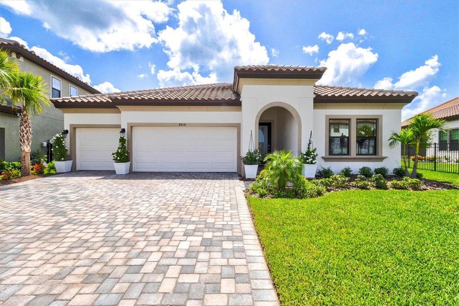 Front exterior of a new home in Crosswind Ranch, Parrish, FL, highlighting curb appeal (Image 27).