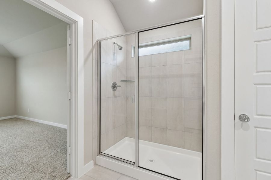 Primary Bathroom in the Emmy II home plan by Trophy Signature Homes - REPRESENTATIVE PHOTO