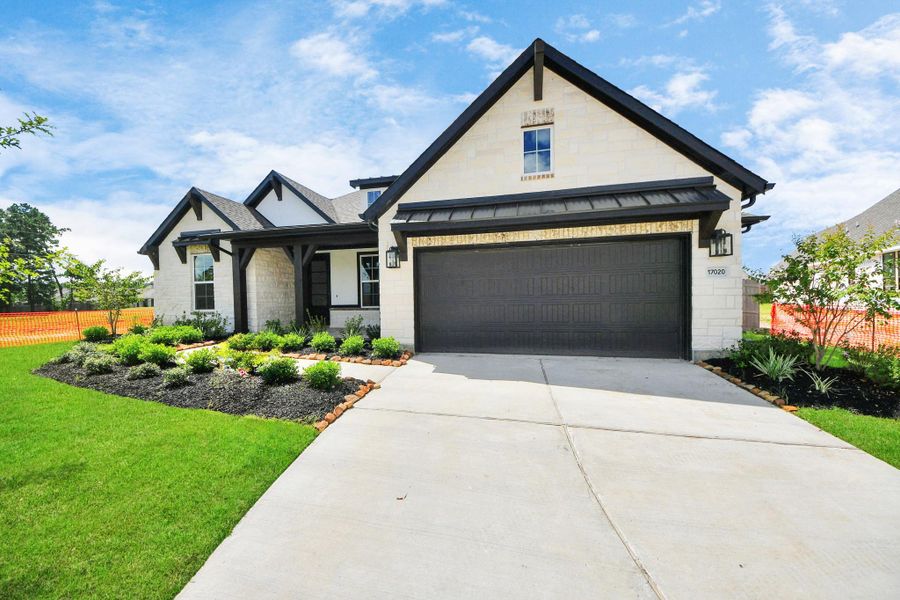 Front exterior of a new home in ARTAVIA: Hilltop Collection, Conroe, TX, highlighting curb appeal (Image 17). Front exterior of a new home in ARTAVIA: Hilltop Collection, Conroe, TX, highlighting curb appeal (Image 17).