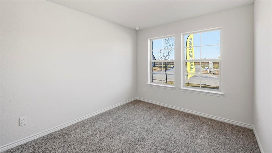 Spare room featuring carpet flooring and baseboards Spare room featuring carpet flooring and baseboards