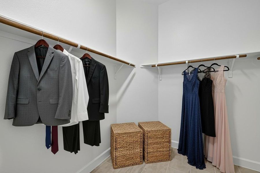 Spacious, virtually staged walk-in closet offering ample storage and organization. Perfect for showcasing your wardrobe in style. Spacious, virtually staged walk-in closet offering ample storage and organization. Perfect for showcasing your wardrobe in style.