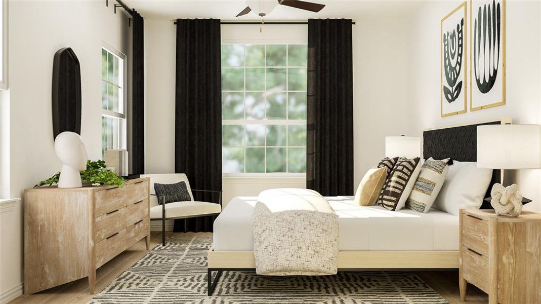 Bedroom featuring ceiling fan and wood-type flooring