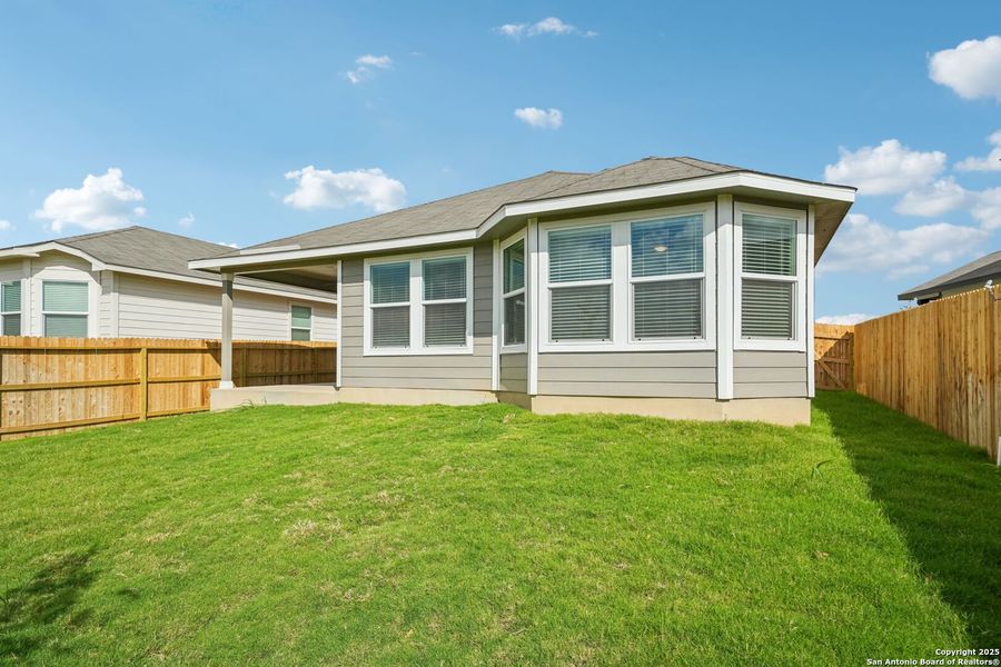 Exterior details and patio area of a home in Estancia Ranch - Premier Series, San Antonio (Image 2). Exterior details and patio area of a home in Estancia Ranch - Premier Series, San Antonio (Image 2).