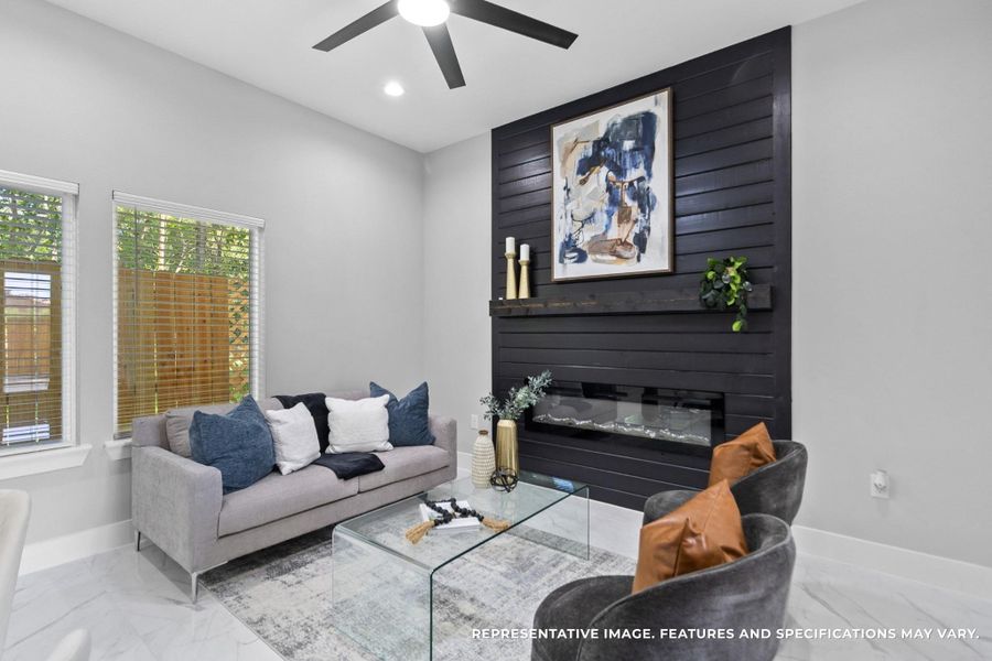 Evenings are your favorite, curled up by the sleek black fireplace wall, where the modern finish creates the perfect backdrop for family time or quiet nights in.