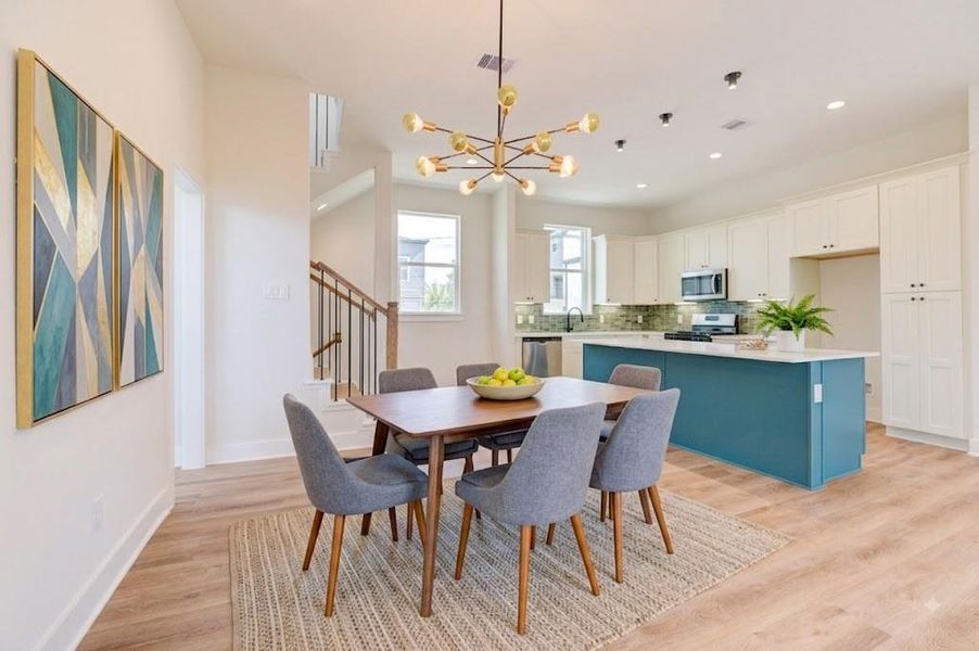 Open dining area with designer pendant. Great space for entertaining in multiple areas. Open dining area with designer pendant. Great space for entertaining in multiple areas.