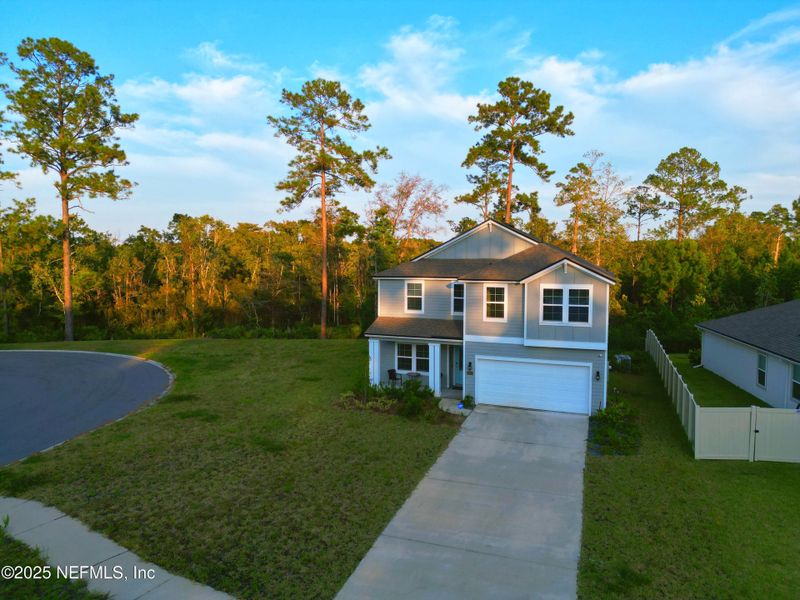 Front exterior of a new home in River Glen, Yulee, FL, highlighting curb appeal (Image 2).