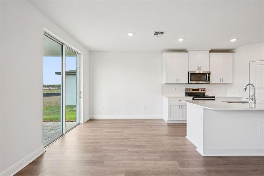 Spacious, unfurnished interior of a new home in The Reserve at Hammock Oaks - Signature Series, Lady Lake (Image 15).