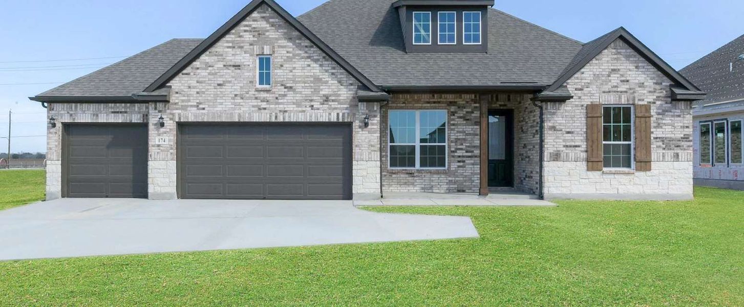 Representative exterior photo of a completed home built from the Carmen by Ashton Woods in Megan's Landing 70's, Castroville, TX (Image 2).