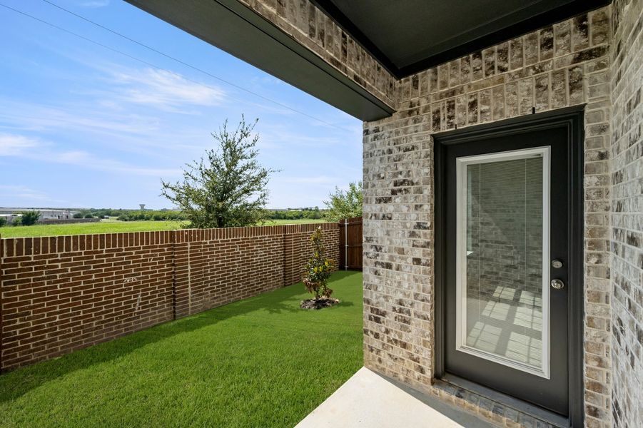 Front exterior of a new home in Main Street Village, Mansfield, TX, highlighting curb appeal (Image 29). Front exterior of a new home in Main Street Village, Mansfield, TX, highlighting curb appeal (Image 29).