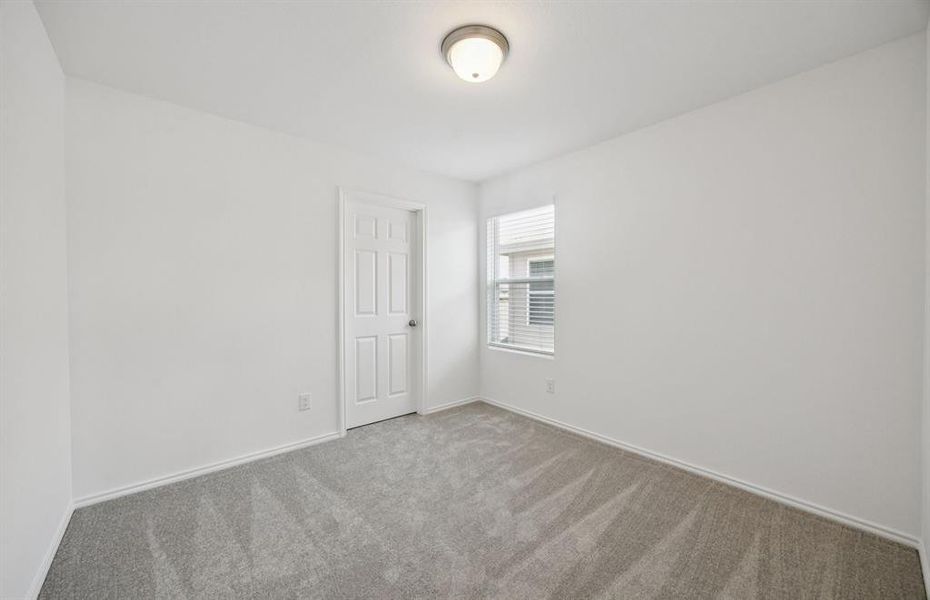 Spacious secondary bedroom with ample closet space