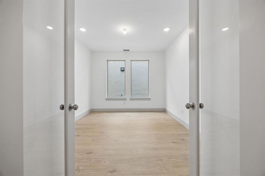The professional working from home will appreciate the privacy this main floor home office provides.