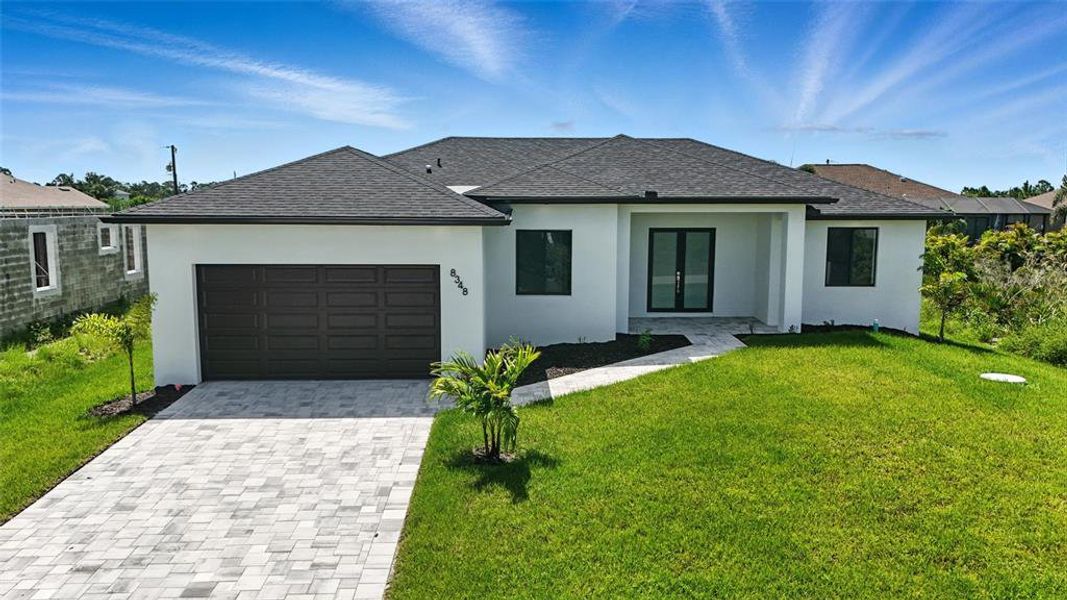 Front exterior of a new home in , Port Charlotte, FL, highlighting curb appeal (Image 19).