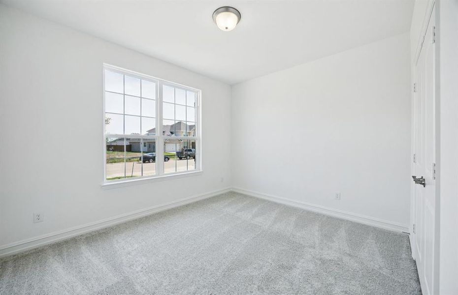 Spacious secondary bedroom with large windows