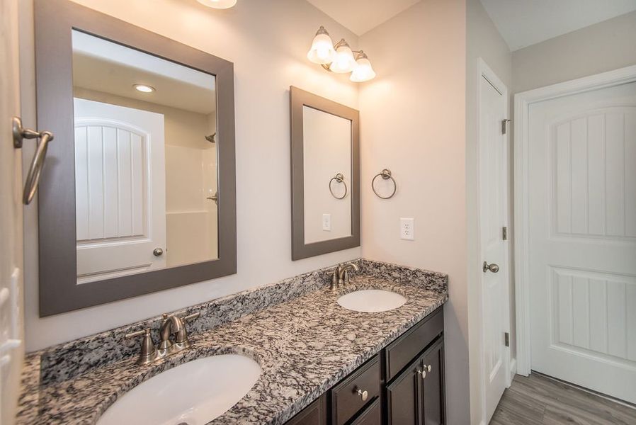 Representative furnished interior of a home built from the Quincy by Enchanted Homes in Hampshire Heights, Moore (Image 14).