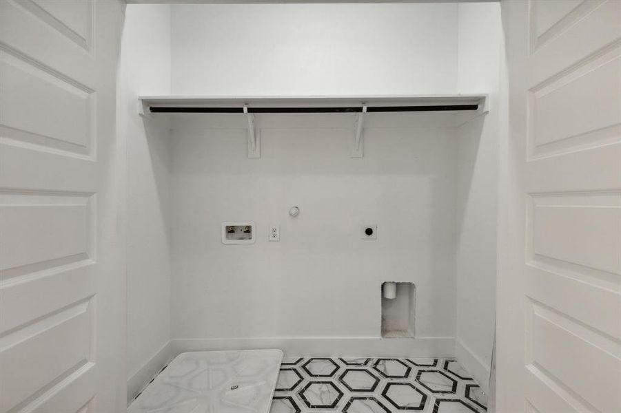 Washroom featuring tile patterned floors, electric dryer hookup, hookup for a washing machine, and gas dryer hookup