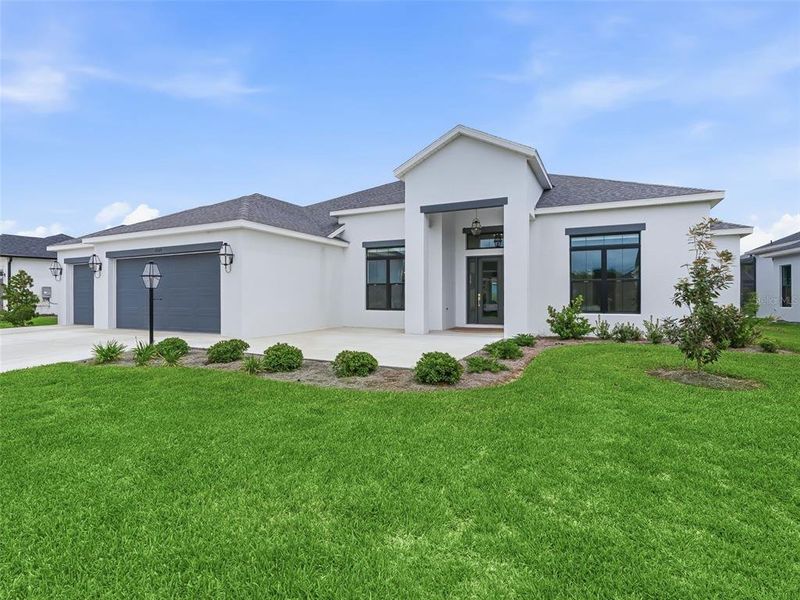 Front exterior of a new home in , The Villages, FL, highlighting curb appeal (Image 28). Front exterior of a new home in , The Villages, FL, highlighting curb appeal (Image 28).