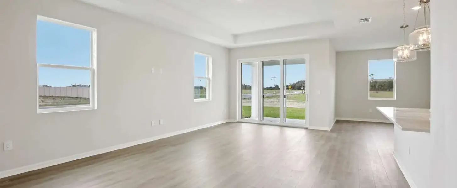 Family room space looks out on to the covered lanai - Representative images and renderings are for illustrative purposes. Actual structural options and design finishes of home may vary.