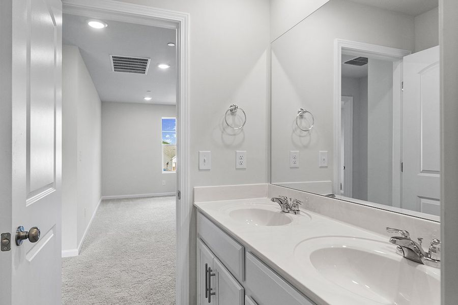 A bathroom with two sinks. A bathroom with two sinks.