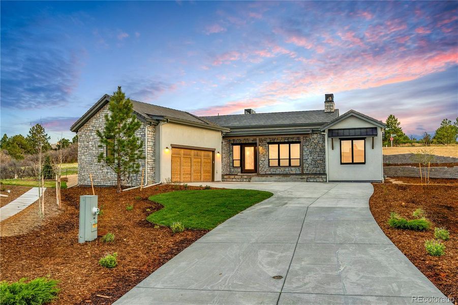 This beautiful new construction Trumark home in the Summit at Castle Pines is move-in ready!