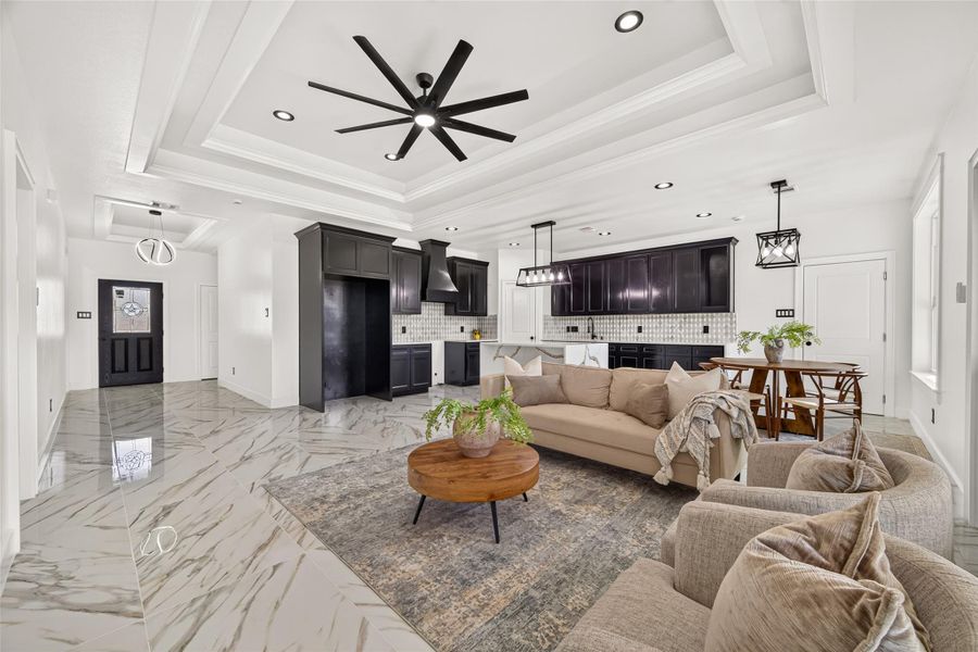 Open-concept living area creates a seamless connection between the kitchen, dining, and gathering spaces.
