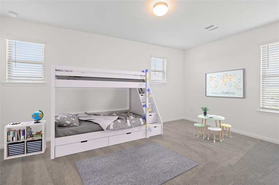 Secondary bedroom features plush carpet, custom paint and a large window.