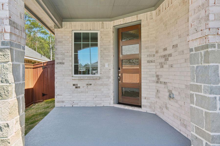 Exterior details and patio area of a home in Woodhavyn 40', Magnolia (Image 3).