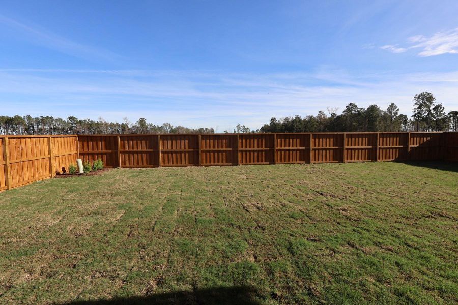 Exterior details and patio area of a home in Woodson’s Reserve, Spring (Image 4).