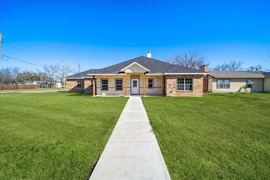 Ranch-style home with a front yard