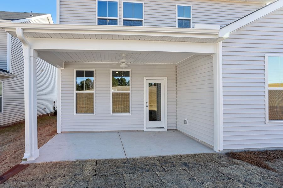 Exterior details and patio area of a home in Renaissance at White Oak, Garner (Image 3).