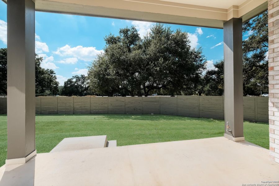 Exterior details and patio area of a home in The Grove at Vintage Oaks, New Braunfels (Image 20).