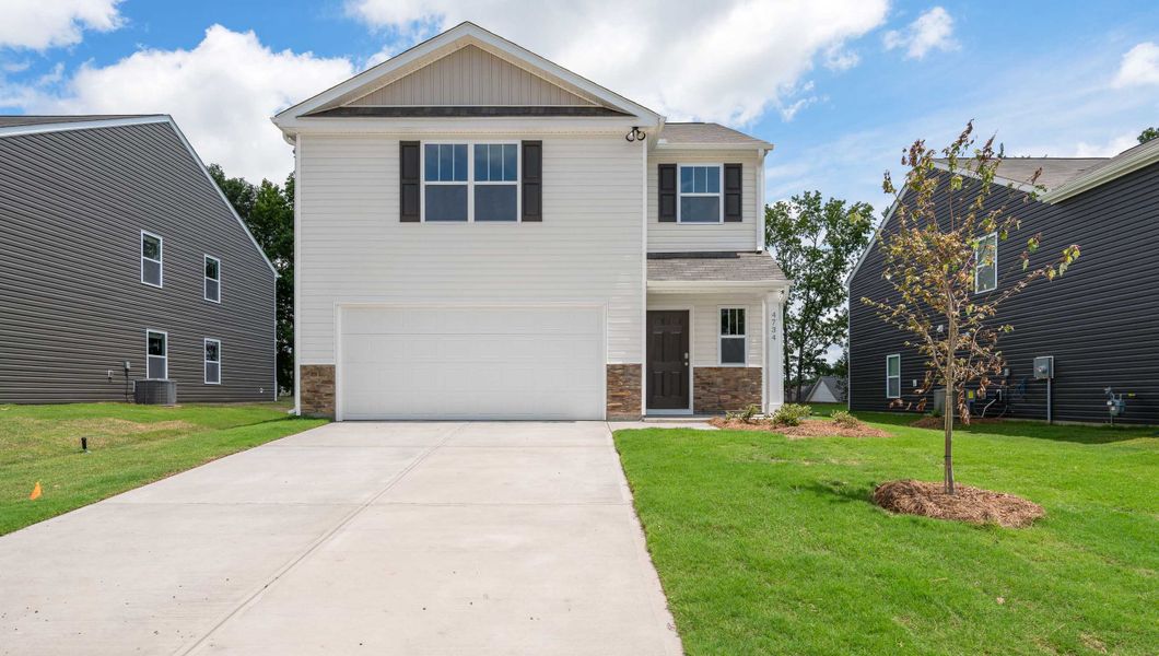 Front exterior of a new home in Harper Ridge, Roebuck, SC, highlighting curb appeal (Image 1).