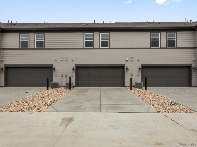 Front exterior of a new home in Poudre Heights: The Meadow Collection, Windsor, CO, highlighting curb appeal (Image 2).
