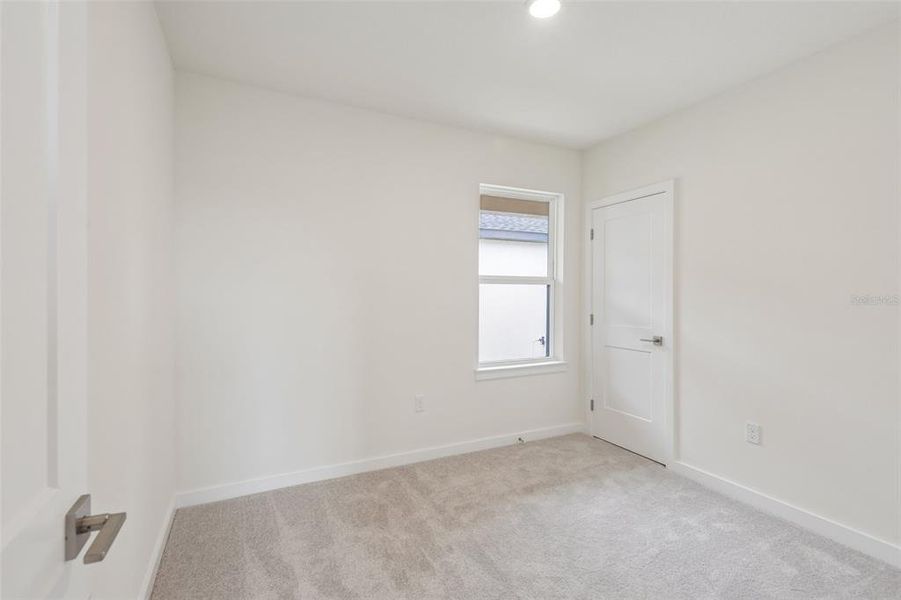 Spacious, unfurnished interior of a new home in Grasslands West, Lakeland (Image 17).