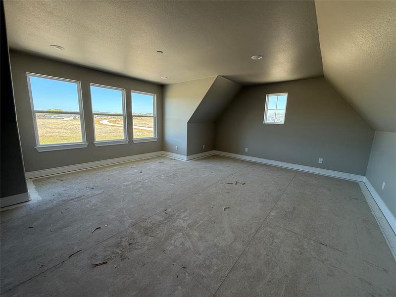 Additional living space featuring baseboards