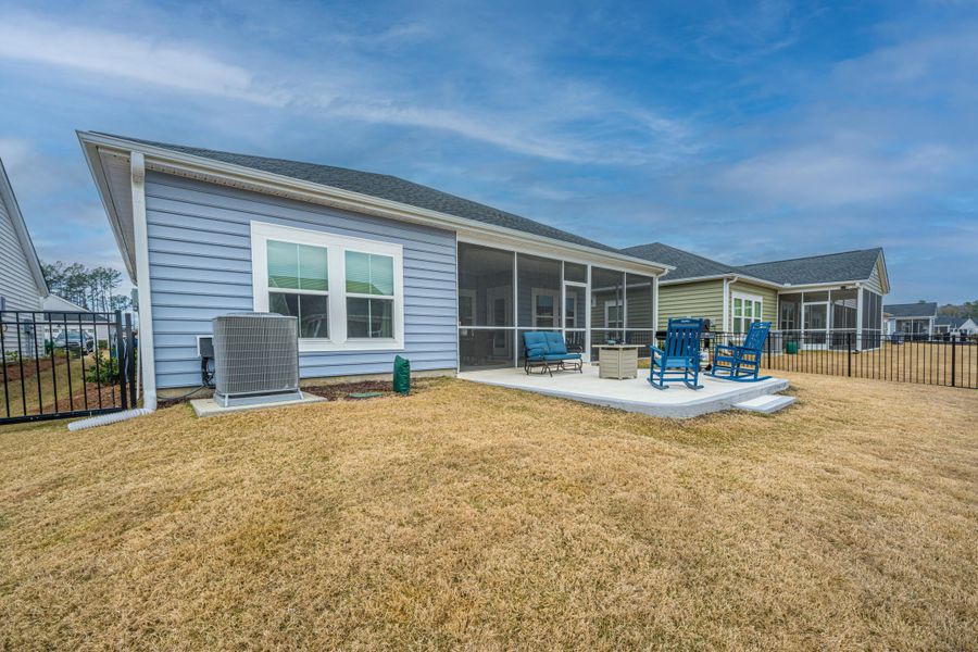Exterior details and patio area of a home in Horizons at Summers Corner | 55+, Summerville (Image 24).