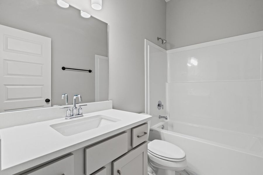 Bathroom with tub / shower combination and vanity