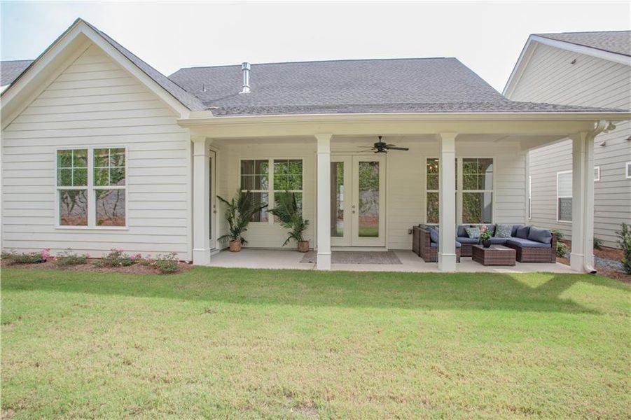 Exterior details and patio area of a home in The Birches on Maple, Carrollton (Image 15).
