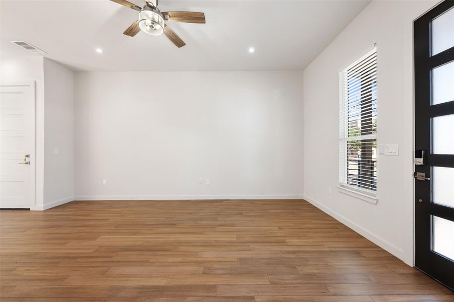 Unfurnished room with recessed lighting, light wood finished floors, and ceiling fan
